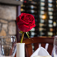 a rose on the table of our main dining room