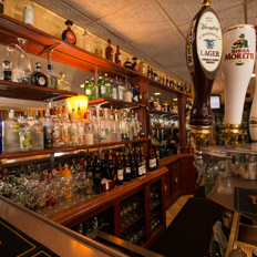 our main bar with bar stool seating areas and high top tables