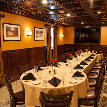 one of our private party rooms that has beautifully wood worked ceilings accompanied by elegant decor