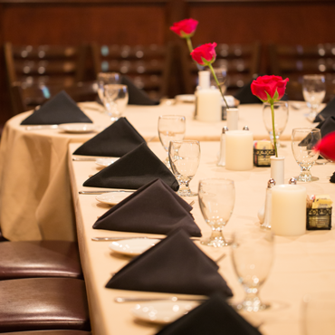 perfectly set table placements on a long table in our private dining room