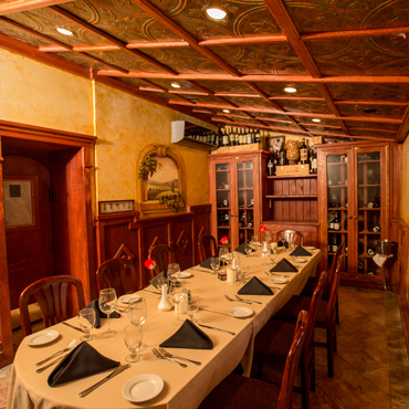 our small private dining room with tin ceilings and amazing woodwork craftsmanship